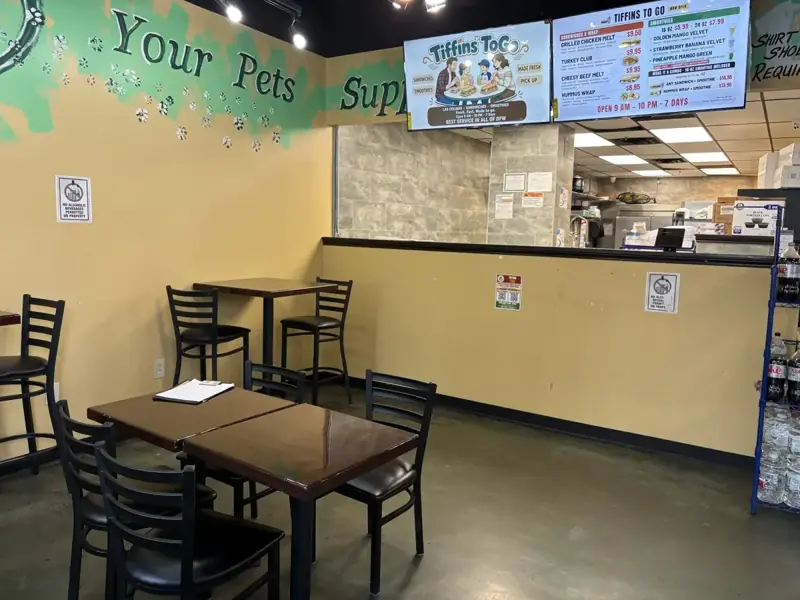 Side view of the Tiffins ToGo counter and seating inside Urban Center Market in Las Colinas