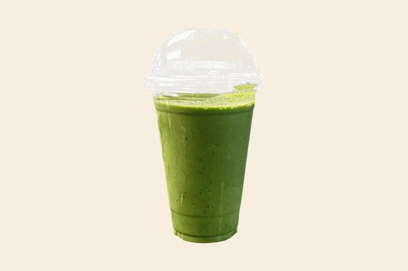Pineapple Mango Green smoothie, green, in a clear domed cup